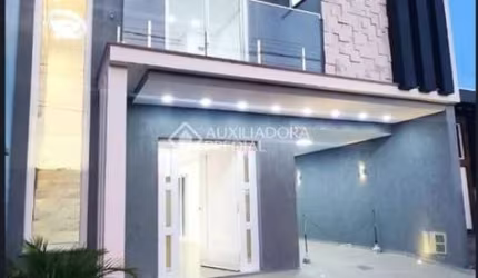 Casa em condomínio fechado com 3 quartos à venda na Avenida Dorival Cândido Luz de Oliveira, 73, São Vicente, Gravataí, 180 m2 por R$ 691.500