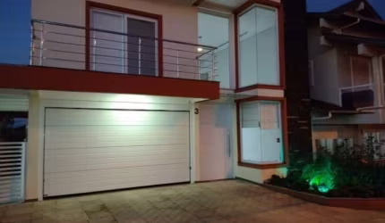 Casa em condomínio fechado com 4 quartos para alugar na Rua Antônio Baggio, 40, Loteamento Jardim Timbaúva, Gravataí, 180 m2 por R$ 7.150