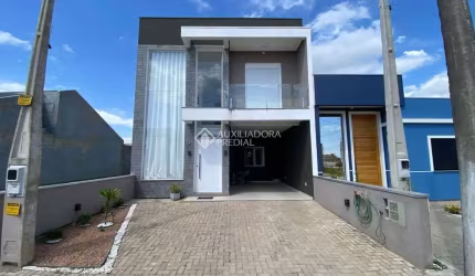 Casa com 3 quartos à venda na Alcides Gomes, 10, Parque dos Anjos, Gravataí, 128 m2 por R$ 630.000