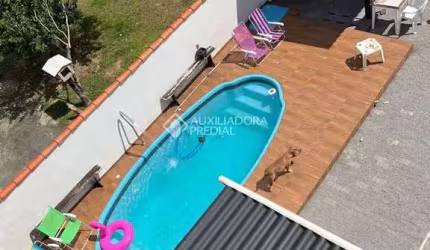 Casa com 3 quartos à venda na Henrique Nicolau Peixer, 95, Enseada de Brito, Palhoça, 200 m2 por R$ 1.049.000