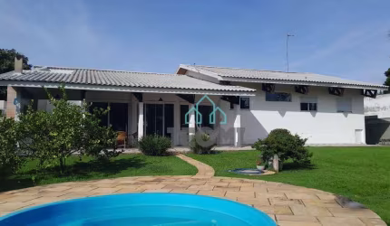 Casa com 4 dormitórios à venda, 346 m² por R$ 2.100.000,00 - Condomínio Vale do Sol - Tremembé/SP