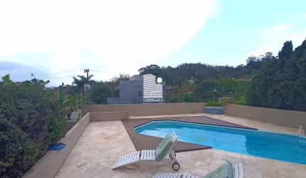 Casa em condomínio fechado com 3 quartos à venda na Estrada Haroldo Soares Glavan, --, Cacupé, Florianópolis por R$ 2.950.000