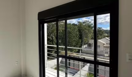 Casa em condomínio fechado com 2 quartos à venda na Rua Rodolfo Weiss, 22, Aririu, Palhoça, 110 m2 por R$ 560.000