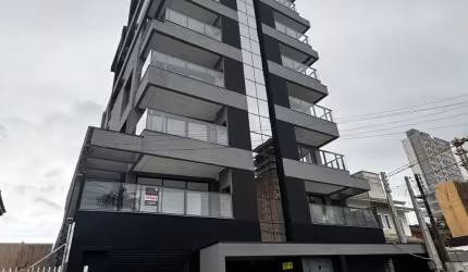 OPORTUNIDADE APARTAMENTO NO CENTRO DE BALNEARIO PIÇARRAS COM TRES QUARTOS SENDO UMA SUITE