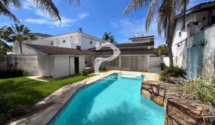 Casa em condomínio fechado com 3 quartos à venda na Doutor Cyro de Mello Pupo (rua 53), --, Jardim Acapulco, Guarujá por R$ 1.300.000