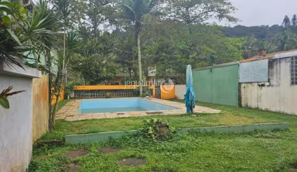 Casa em condomínio fechado com 1 quarto à venda no Balneário Praia do Pernambuco, Guarujá  por R$ 650.000