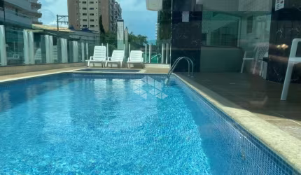 apartamento a venda na praia grande, bairro caiçara com 2 quartos 1 suite e 1 vaga.