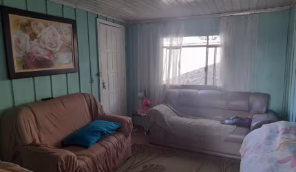 MEIO LOTE COM CASA