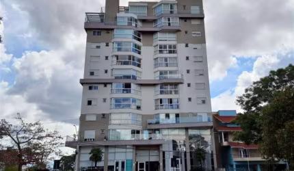 Apartamento com três quartos, um com suíte e vestir,  sala de jantar  e estar com sacada, banheiro social,  cozinha, área de serviço e dois boxes de garagem. Rebaixo em gesso, água quente, piso lamina