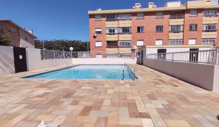 Apartamento em prédio com piscina na praia Capão Novo
