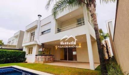 Vende magnífica casa em condomínio com 620m², 4 suítes e lazer.
