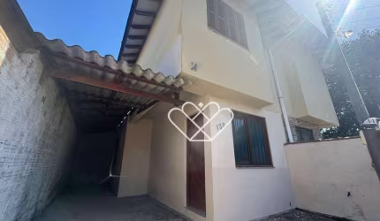 Casa de Dois Pisos no Bairro Natal, Próxima ao Centro de Gravataí - Conforto e Praticidade ao Seu Alcance!