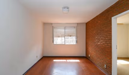 Apartamento de 1 Dormitório no Edifício Dona Tereza: Conforto e Iluminação no Centro