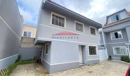 Sobrado de 3 quartos com ampla suíte em condomínio no Uberaba, Curitiba-PR: 98m², 2 vagas. Venha conhecer!