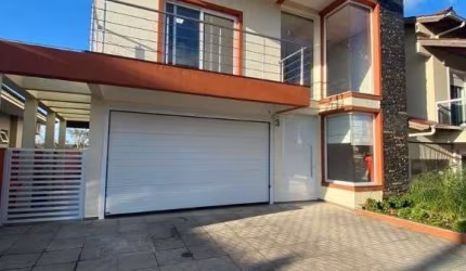 Sobrado com 4 dormitórios para alugar, 180 m² por R$ 7.230,00/mês - Loteamento Jardim Timbaúva - Gravataí/RS