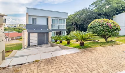 Sobrado com 4 dormitórios para alugar, 380 m² por R$ 8.610,00/mês - Loteamento Jardim Timbaúva - Gravataí/RS