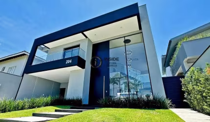 Casa com piscina e 5 suítes no condomínio acapulco