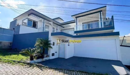 Casa com 4 dormitórios, 302 m² - venda por R$ 1.300.000,00 ou aluguel por R$ 7.200,00/mês - Jardim Guanabara - Macaé/RJ