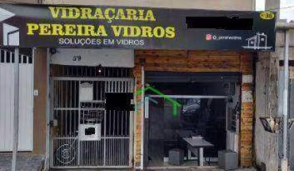 Excelente Terreno com 4 Casas, Salão Comercial e Garagem para Renda - Ótima Localização!