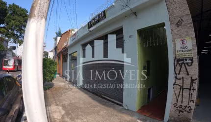 Terreno com 2 casas e porta comercial a venda na Penha
