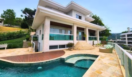 Casa em condomínio fechado com 5 quartos para alugar na Rodovia Haroldo Soares Glavan, 910, Cacupé, Florianópolis por R$ 23.000