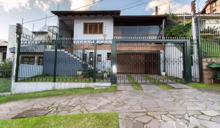 Casa com 3 quartos à venda na Rua Doutor Egydio Michaelsen, 250, Cavalhada, Porto Alegre por R$ 998.000