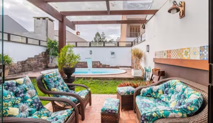 Casa com 3 quartos à venda na Rua Corticeira, 754, Hípica, Porto Alegre por R$ 730.000