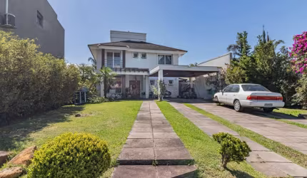 Casa em condomínio fechado com 3 quartos à venda na Avenida Juca Batista, 8000, Belém Novo, Porto Alegre por R$ 2.150.000