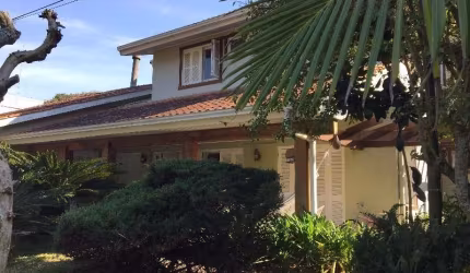 Casa em condomínio fechado com 5 quartos à venda na Avenida Coronel Marcos, 1334, Pedra Redonda, Porto Alegre por R$ 2.300.000
