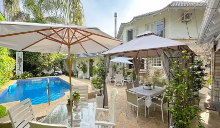 Casa em condomínio fechado com 3 quartos à venda na Rua Professor Carlos de Paula Couto, 505, Cavalhada, Porto Alegre por R$ 3.850.000