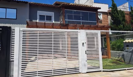 Casa em condomínio fechado com 3 quartos à venda na Rua Aldo Sani, 84, Hípica, Porto Alegre por R$ 790.000