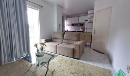 Ótimo apartamento em ótima localização no bairro Forquilhinha, 2 dormitórios, sacada com churrasqueira, mobiliado.
