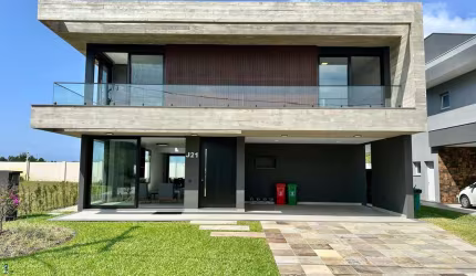 Casa em condomínio fechado com 5 quartos à venda no Capão Novo, Capão da Canoa  por R$ 3.990.000