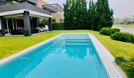 Casa em condomínio fechado com 5 quartos à venda na Avenida Central, 2500, Atlântida, Xangri-Lá por R$ 8.000.000