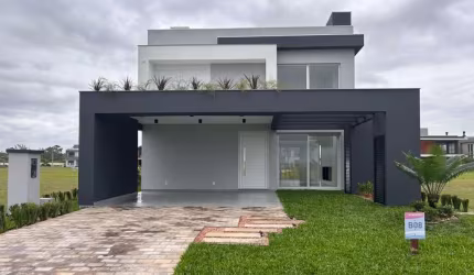 Casa em condomínio fechado com 3 quartos à venda na Ipanema, 521, Curumim, Capão da Canoa por R$ 1.880.000
