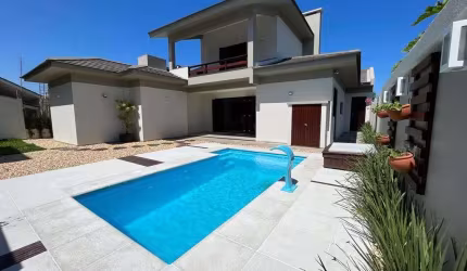Casa com 4 quartos à venda na Rua Miraguaia, 505, Atlântida, Xangri-Lá, 270 m2 por R$ 1.980.000
