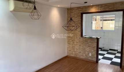 Casa em condomínio fechado com 2 quartos para alugar na Rua dos Guaramirins, 303, Igara, Canoas, 90 m2 por R$ 1.800