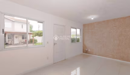 Casa em condomínio fechado com 3 quartos para alugar na Rua dos Guaramirins, 303, Igara, Canoas, 107 m2 por R$ 2.500