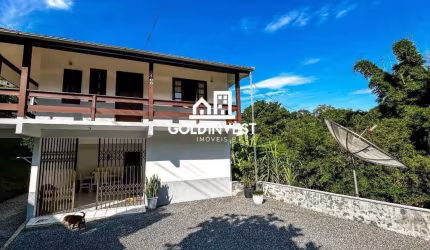 Casa com 4 quartos e amplo terreno no bairro Souza Cruz