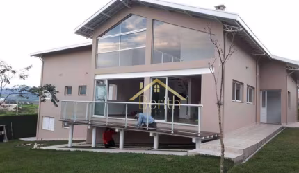 Sobrado com 4 dormitórios à venda, 300 m² por R$ 1.500.000,00 - Condomínio Village da Serra - Tremembé/SP