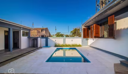 Casa em condomínio fechado com 3 quartos à venda na Avenida Engenheiro Ary de Abreu Lima, 311, Jardim Europa, Porto Alegre por R$ 1.090.000