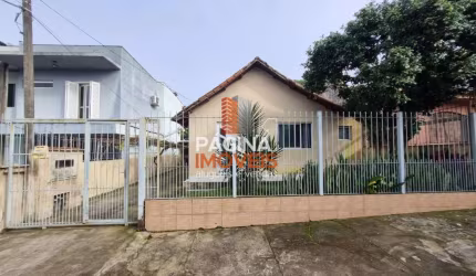 Página 1 Imóveis anuncia casa mista de 3 dormitórios com amplo terreno, para venda no bairro Nossa Senhora das Graças, Canoas/RS. - CA213