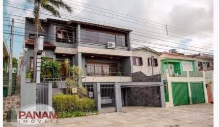 Casa com 5 quartos à venda na Beco Circular, 631, Vila Jardim, Porto Alegre por R$ 1.980.000