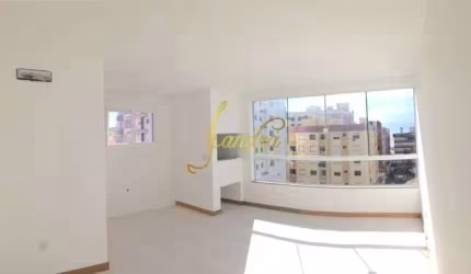 Apartamento padrão três dormitorios com móveis fixos e garagem