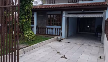 Casa com 3 quartos à venda na Rua Santa Maria, Maracanã, Colombo, 204 m2 por R$ 750.000