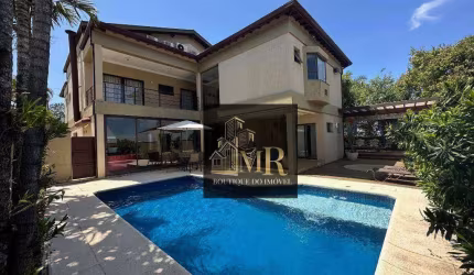 Alphaville Campinas  - Casa de esquina com 5 dormitórios sendo 3 suítes com terraço, escritório e amplas salas.   522.7 m² Área Construída 635.38 m²