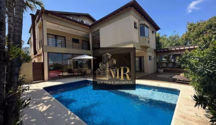 Alphaville Campinas  - Casa de esquina com 5 dormitórios sendo 3 suítes com terraço, escritório e amplas salas.   522.7 m² Área Construída 635.38 m²