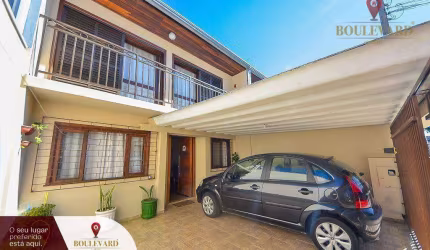 Sobrado de frente para a rua, com 3 dormitórios à venda, 110 m² por R$ 550.000 - Uberaba - Curitiba/PR