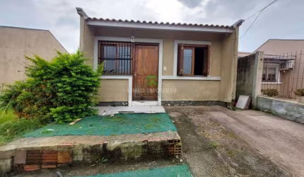 Casa à venda em Porto Alegre-RS, bairro Hípica: 2 quartos, 1 suíte, 2 salas, 2 banheiros, garagem e 80m² de área. Imperdível!