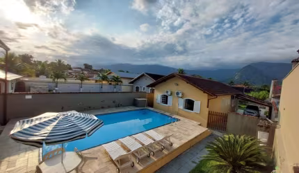 Viva o sonho na praia: casa à venda em Morada da Praia, Bertioga/SP - 3 quartos, piscina, área gourmet e muito mais!